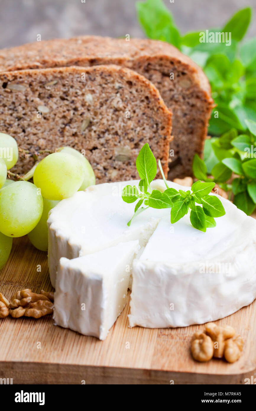Goat cheese with fruits and whole grain bread Stock Photo Alamy