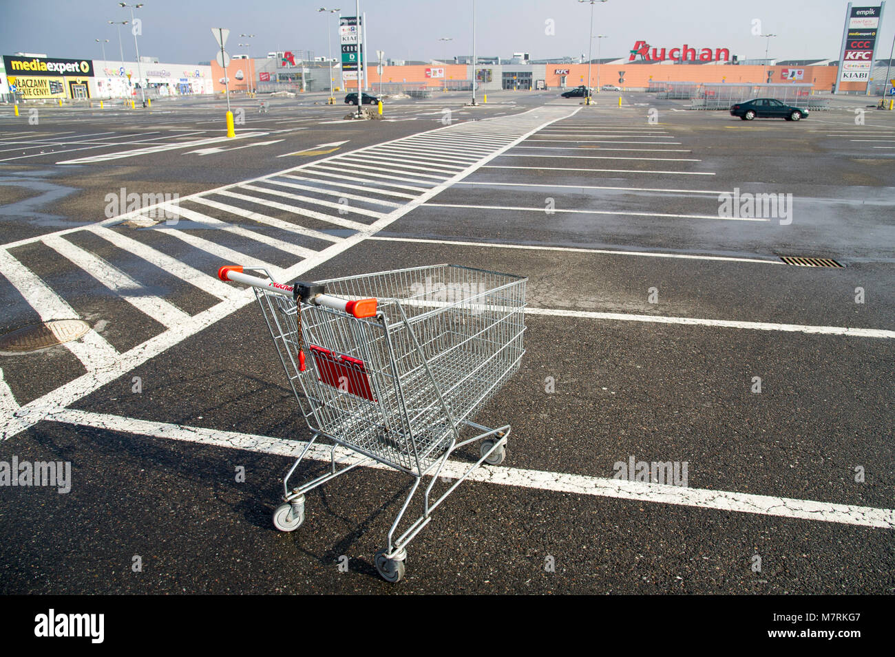 Parked shopping carts equipped with coinoperated locking mechanisms in
