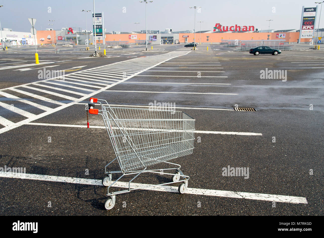 Parked shopping carts equipped with coinoperated locking mechanisms in