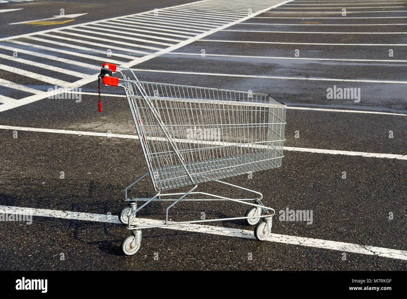 Parked shopping carts equipped with coinoperated locking mechanisms in