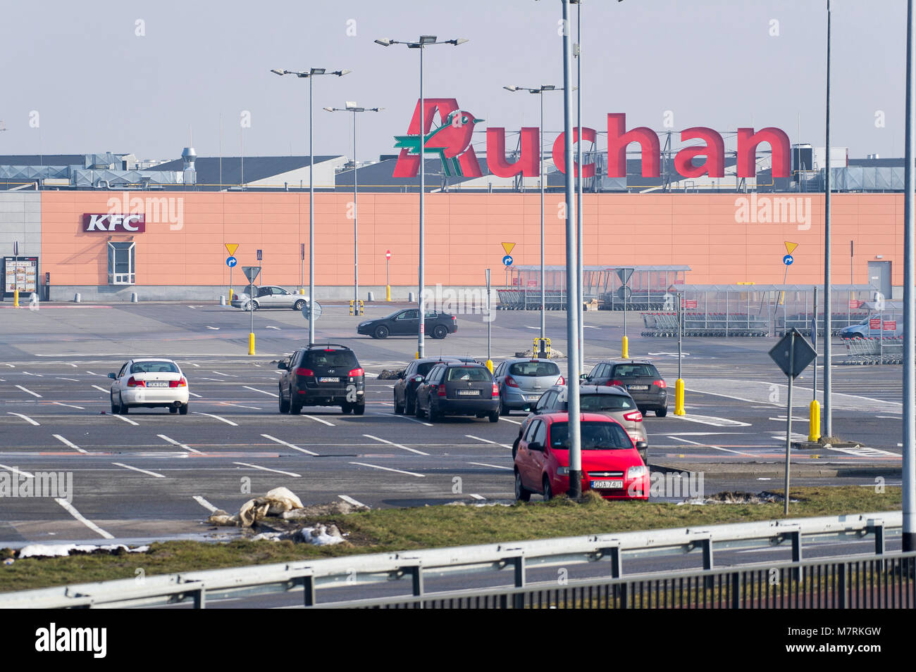 Empty parking of shopping mall Auchan in the beginning of law restriction  for Sunday shopping in Poland to ban a trade for large supermarkets and  reta Stock Photo - Alamy