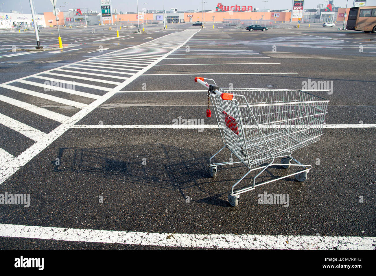 Parked shopping carts equipped with coinoperated locking mechanisms in