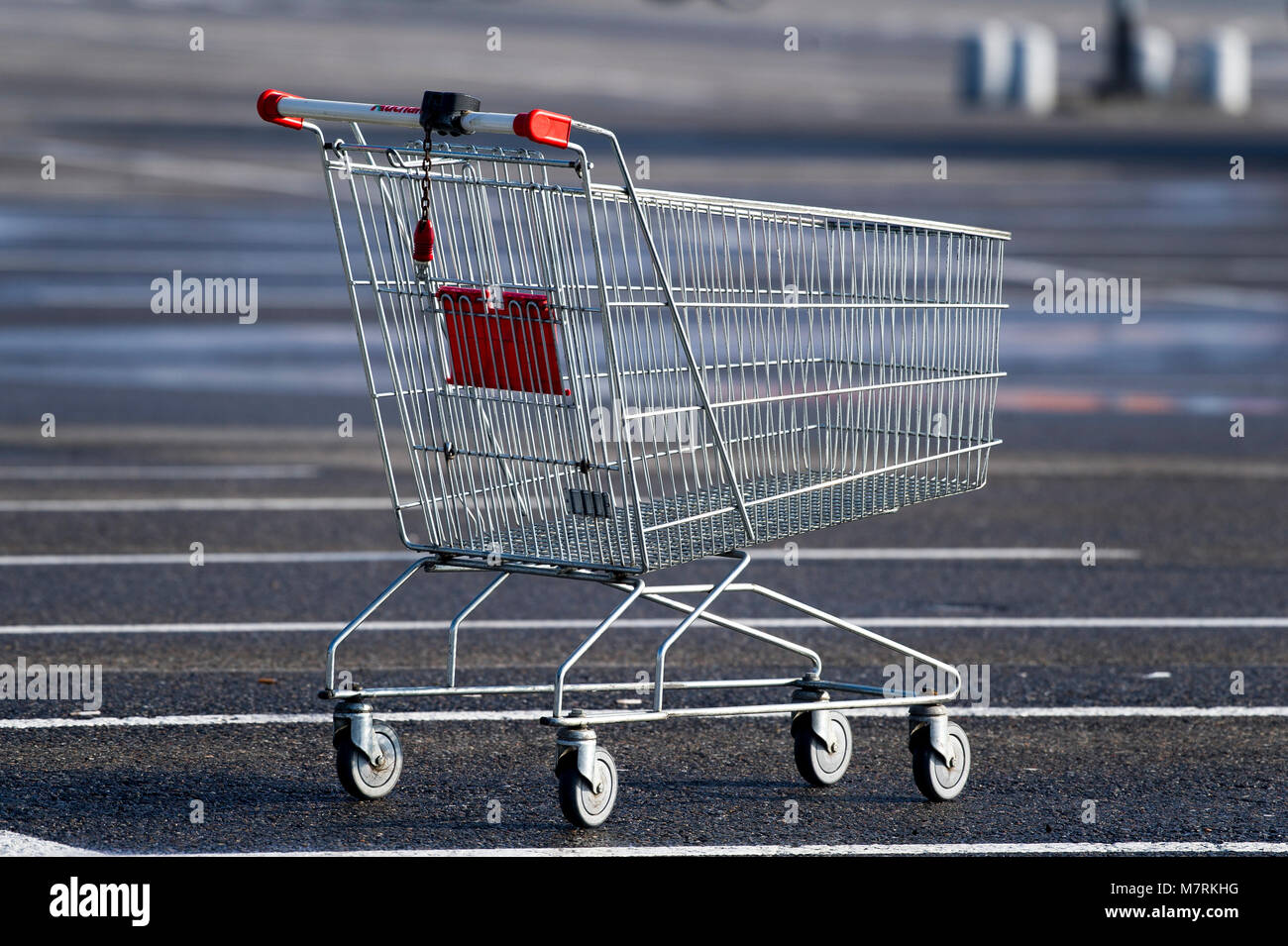 Parked shopping carts equipped with coinoperated locking mechanisms in