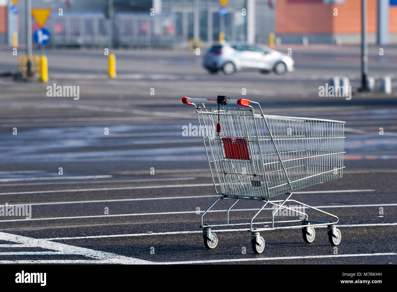 Parked shopping carts equipped with coinoperated locking mechanisms in