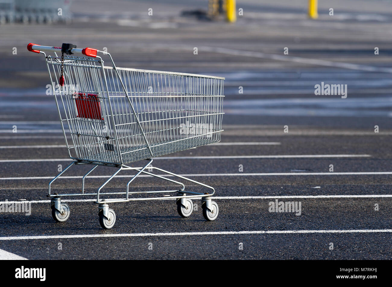 Parked shopping carts equipped with coinoperated locking mechanisms in