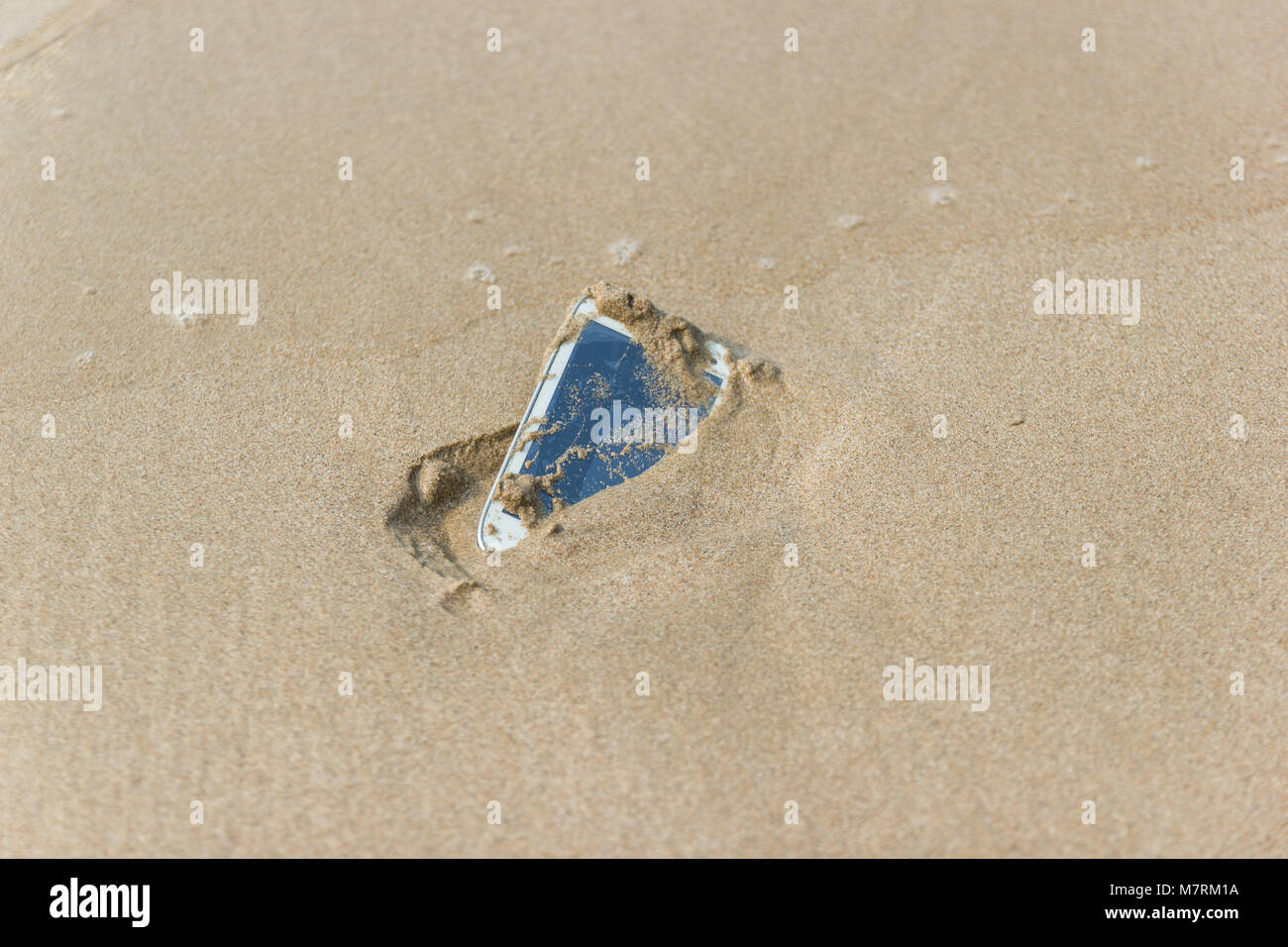 Mobile phone floated to the sea at the beach Stock Photo Alamy