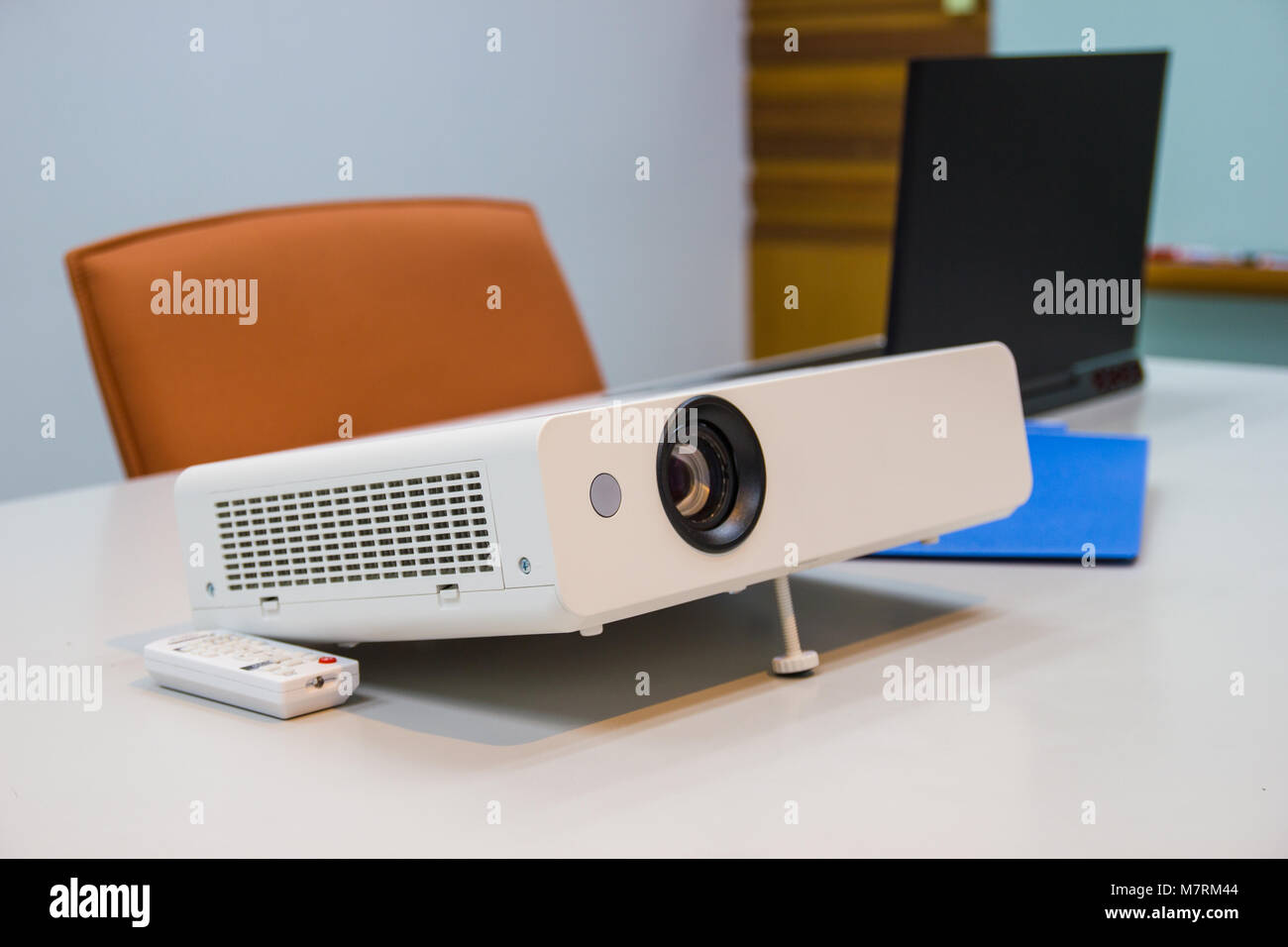 projector connected to Laptop on for  presentation in a meeting room, business concept. Stock Photo