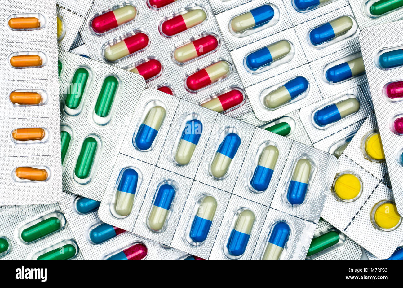 Top view of colorful tablets and capsules pills in blister packs. Global health care and drug use with reasonable concept. Antibiotics resistance conc Stock Photo