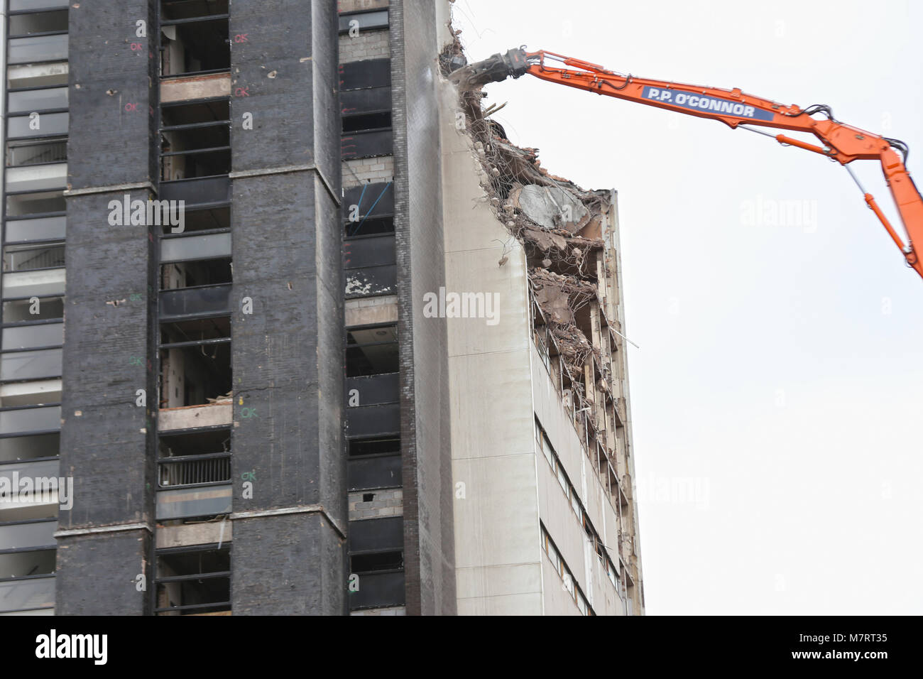 High reaching machinery demolishes tower block in West Gorton, Manchester Stock Photo