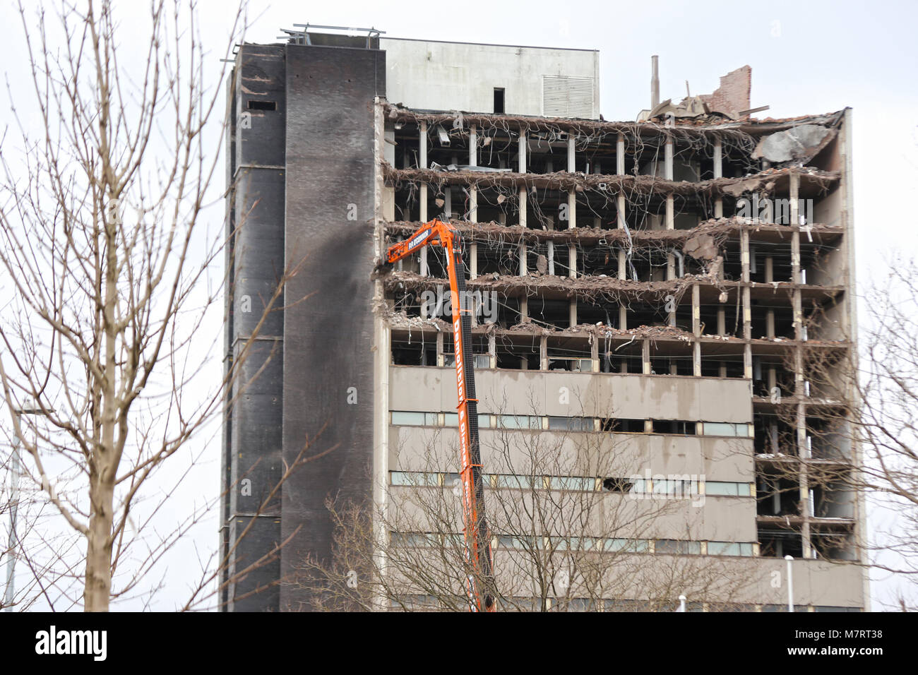 High reach machinery demolishes office block in West Gorton, Manchester Stock Photo