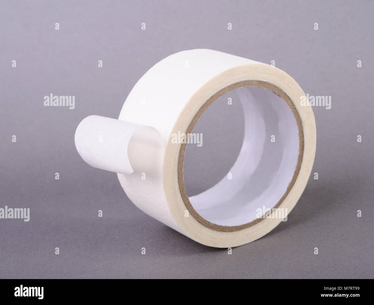 Roll of paper adhesive tape on gray background Stock Photo