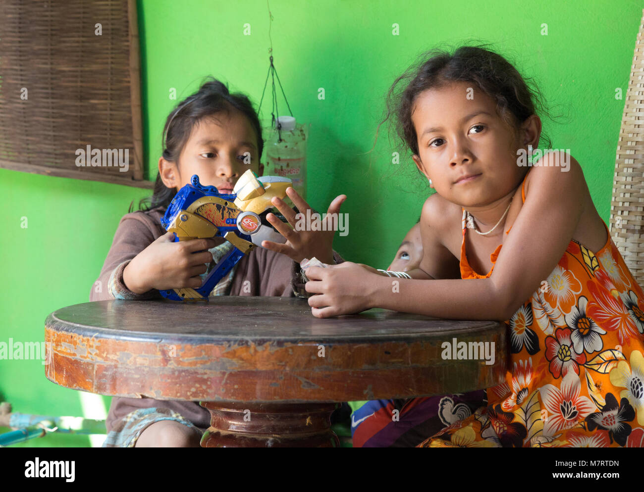 Cambodia children playing with toys,- two girls aged 8-10 years, Phnom  Penh, Cambodia, Asia Stock Photo - Alamy