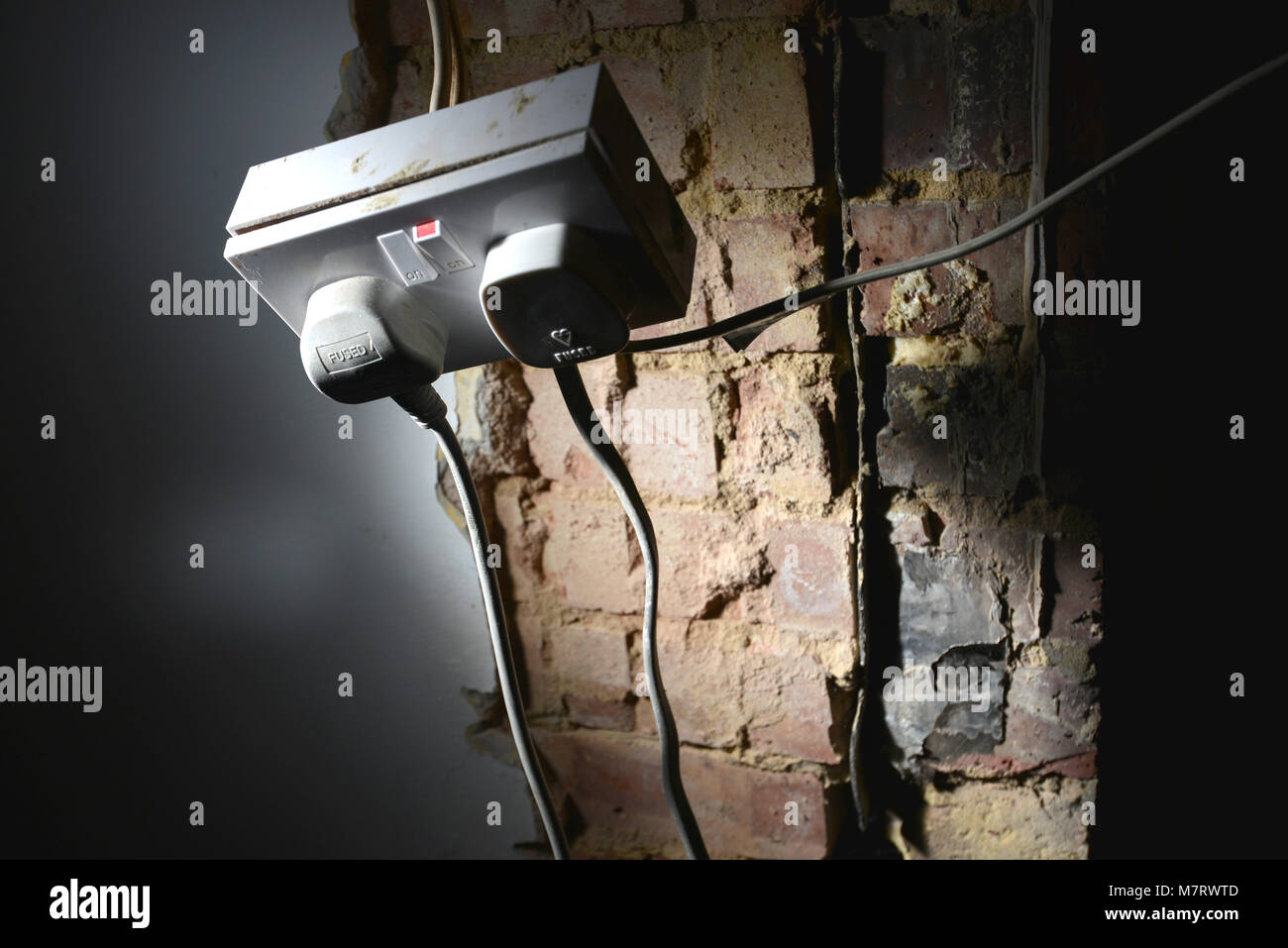 Dangerous wiring on a UK electricity socket, Stock Photo