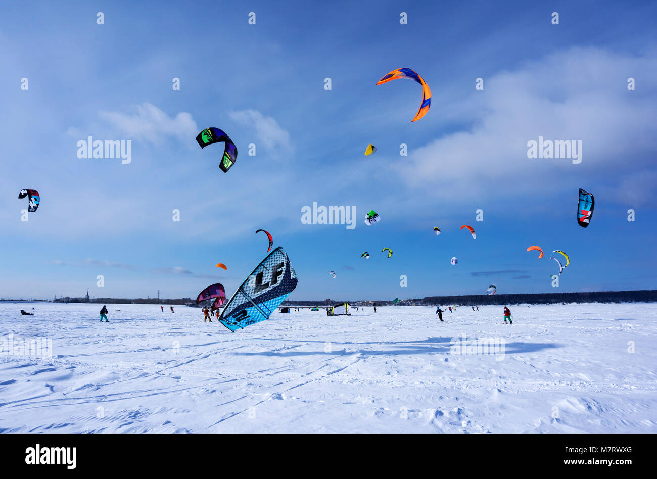 PERM, RUSSIA - MARCH 09, 2018: snow kiters rides on the ice of a frozen river Stock Photo