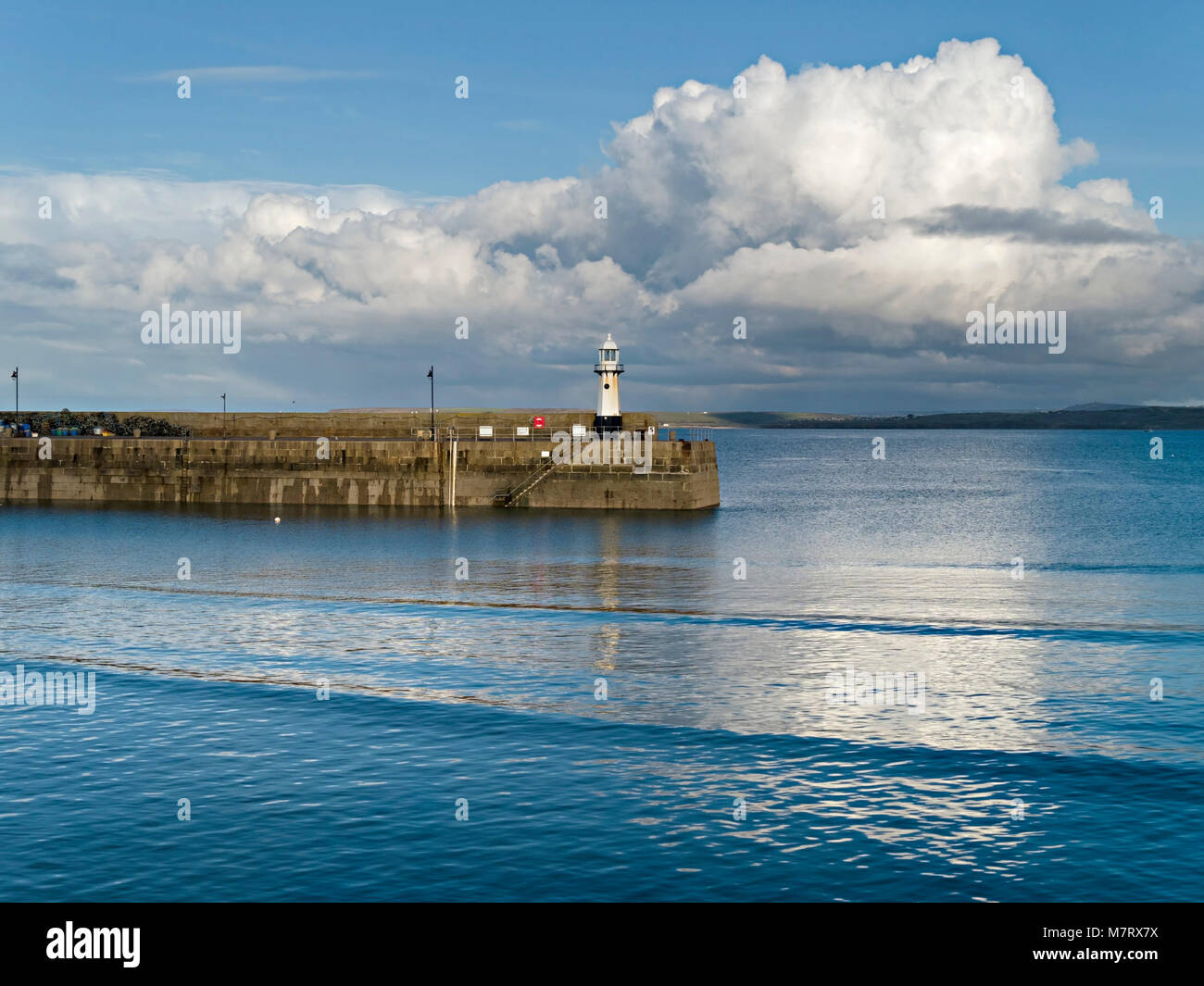 Evening light on Smeatons Pier and old lighthouse at high tide, St. Ives harbour, Cornwall, England, UK Stock Photo