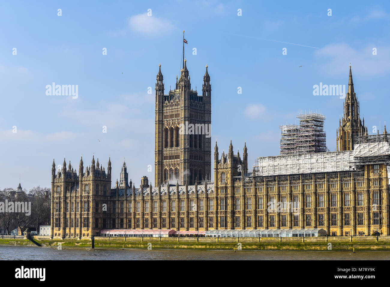 Palace of Westminster, Houses of Parliament, Westminster and River Thames, London, UK. Blue sky. Government. Scaffolding for renovation restoration Stock Photo