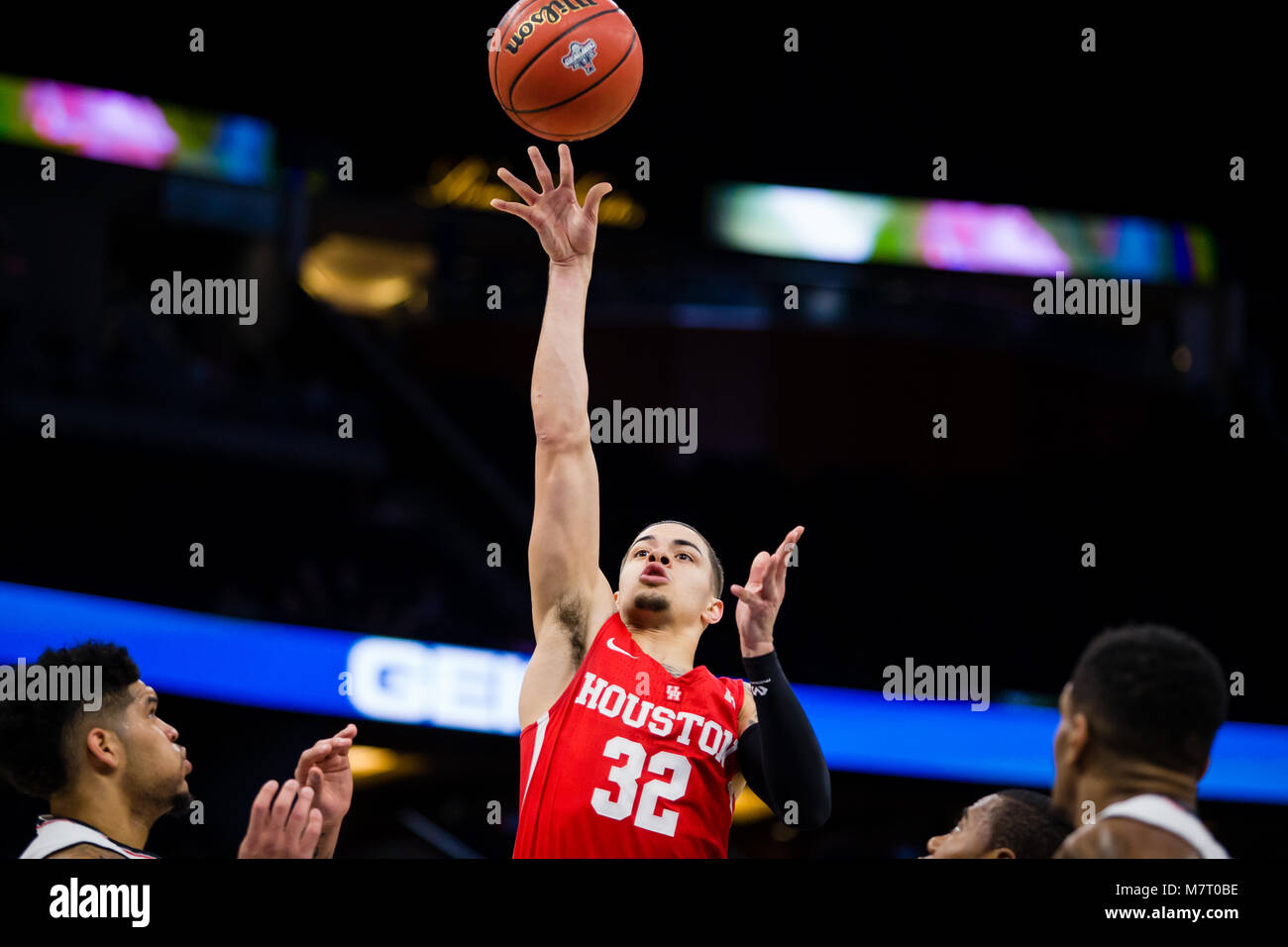 Houston G Rob Gray shoots a basket amid multiple Cincinnati defenders during the 2018 American Athletic Conference Championship at the Amway Center. Stock Photo