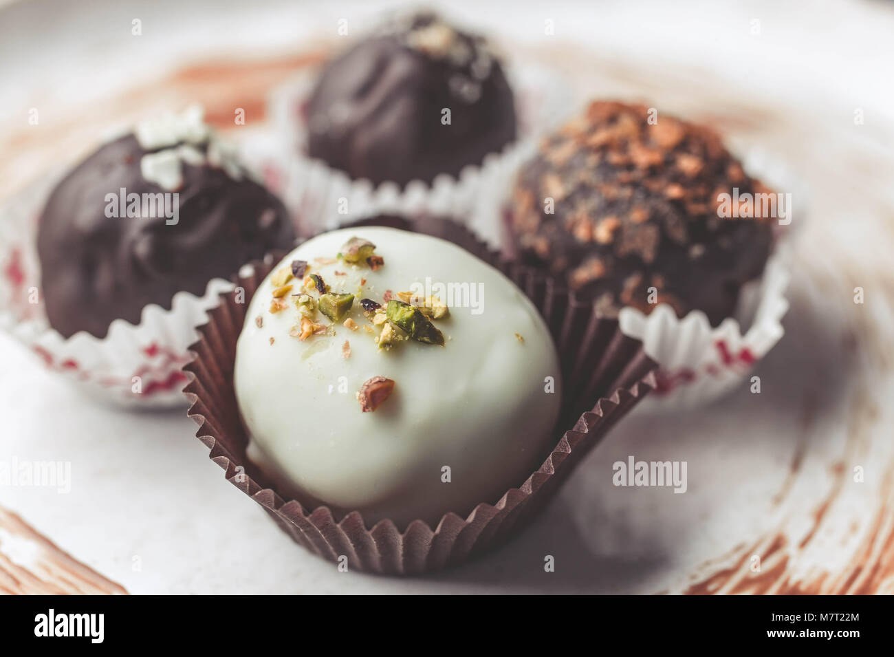 Handmade chocolates with cheese stuffing. white and classical dark