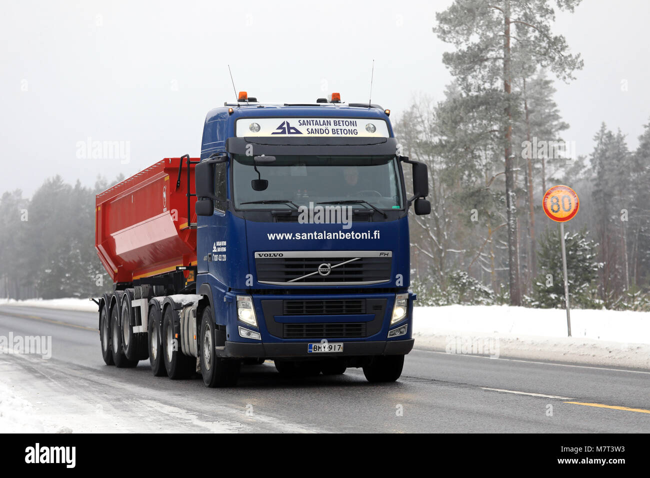 RAASEPORI, FINLAND - FEBRUARY 9, 2018: Blue Volvo FH tipper truck of Santalan Betoni Oy moves along highway in winter snowfall in South of Finland. Stock Photo