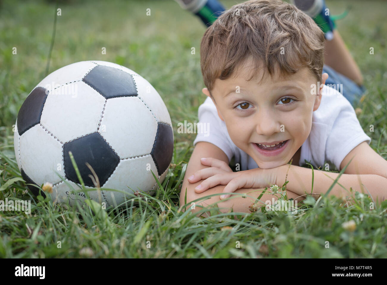 Portrait of a young  boy with soccer ball. Concept of sport. Stock Photo
