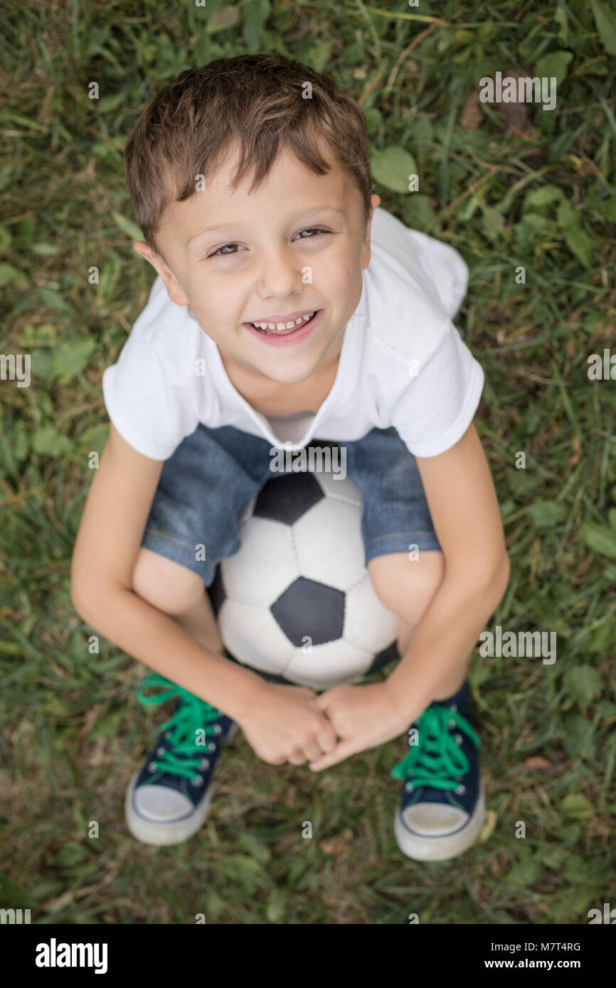 Portrait of a young boy with soccer ball. Concept of sport Stock Photo