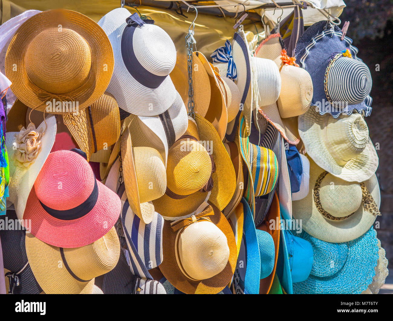 Elegant colorful women straw hats collection,hats for sale at a market  Stock Photo - Alamy