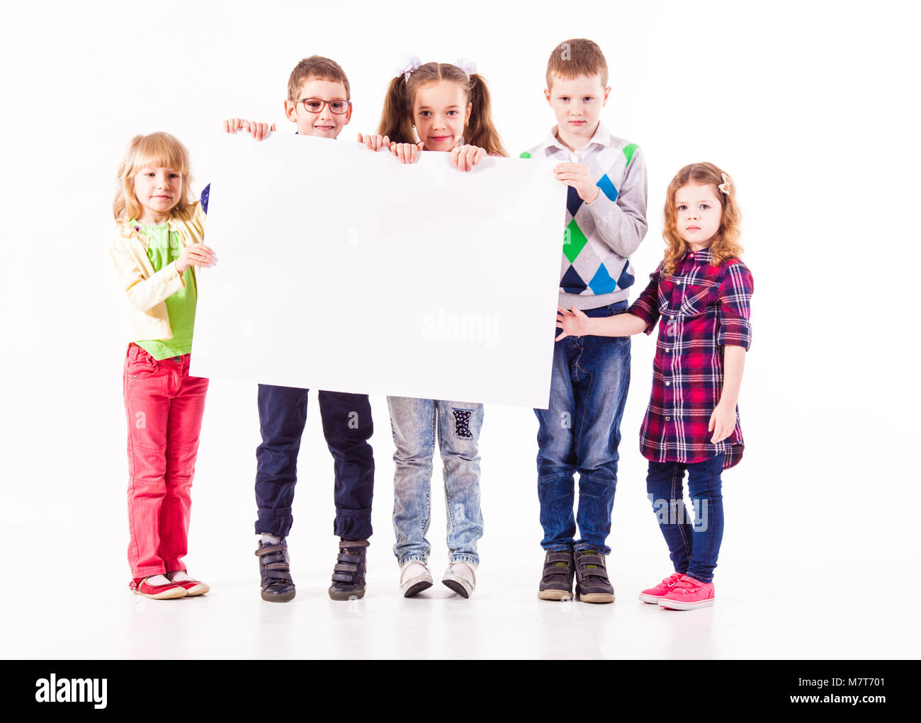 The kids are holding a white blank Stock Photo - Alamy