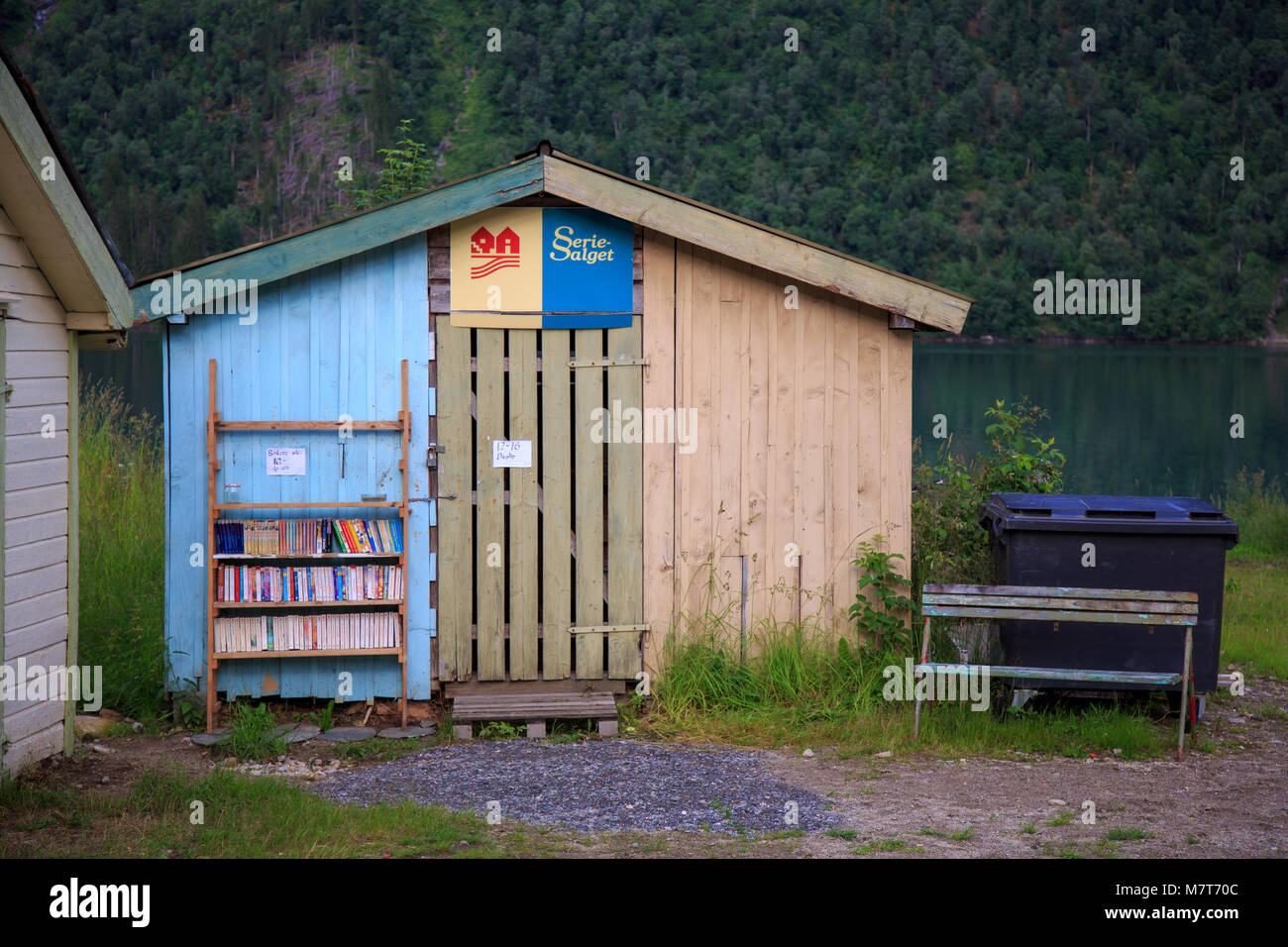 Small bookshop in the Norwegian booktown Fjærland. Shop is closed, but books are available from the bookshelf outside taking payment in a jar Stock Photo