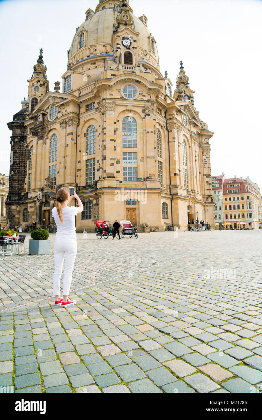 Girl makes photos shots of european city Dresden and selfie of background  old German town Stock Photo - Alamy