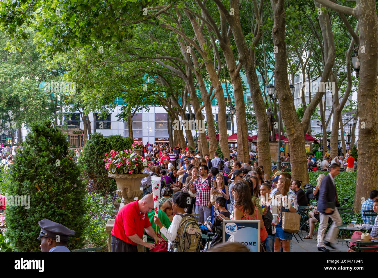 People in Bryant Park  a public park in Midtown Manhattan a warm summer day , Manhattan ,New York Stock Photo