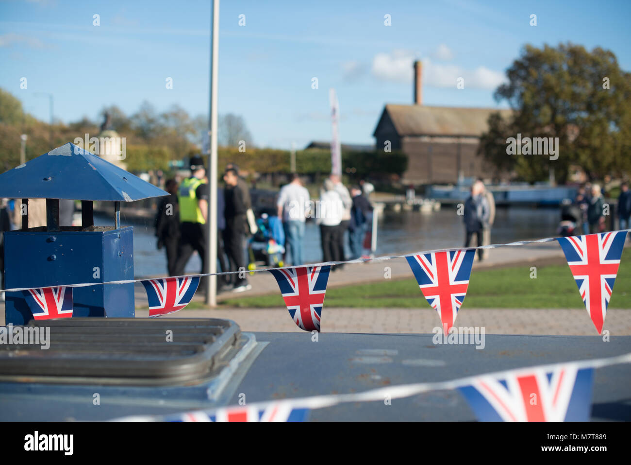 red white and blue union jack bunting with typical British scene in the ...