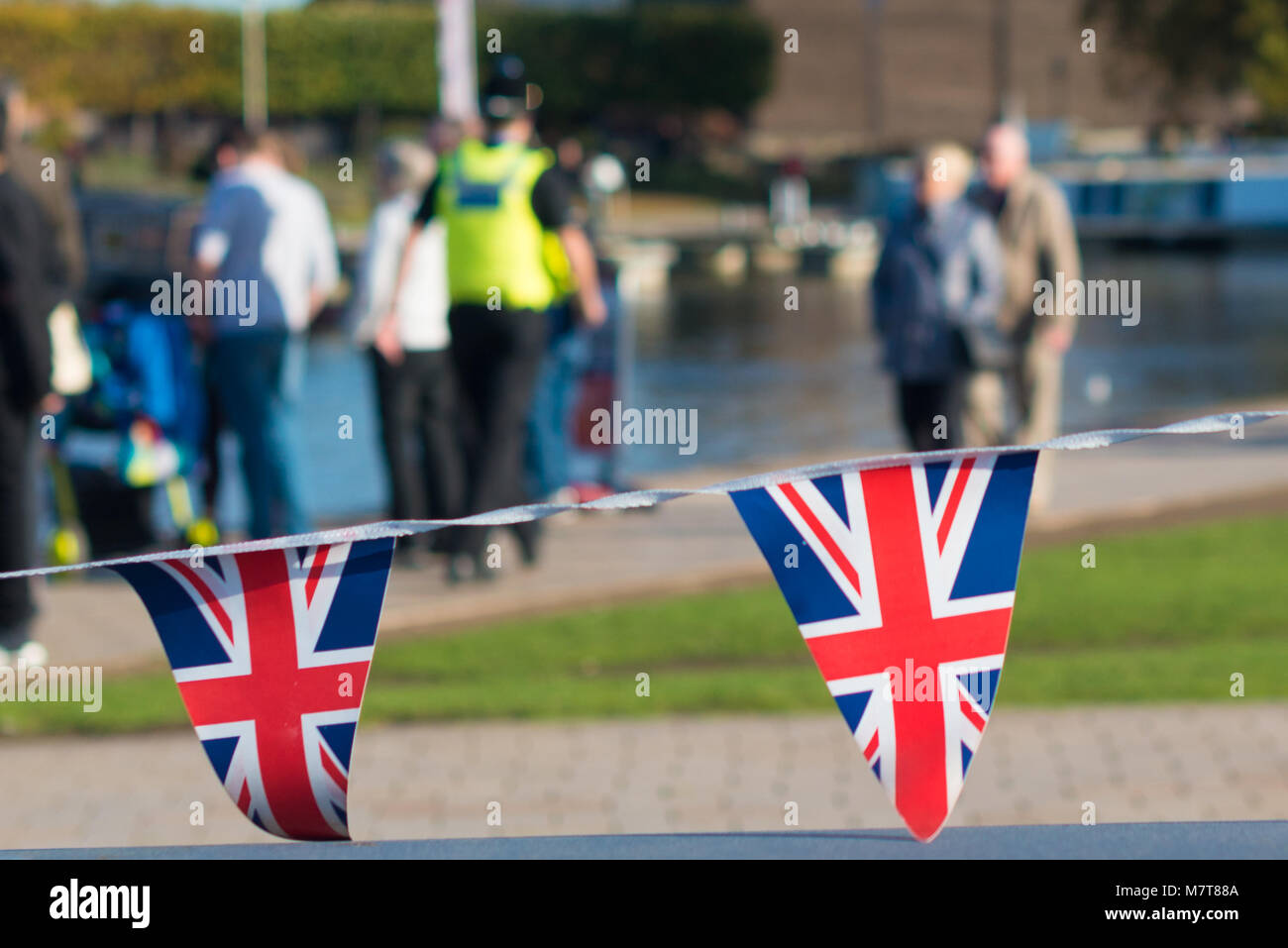 red white and blue union jack bunting with typical British scene in the ...