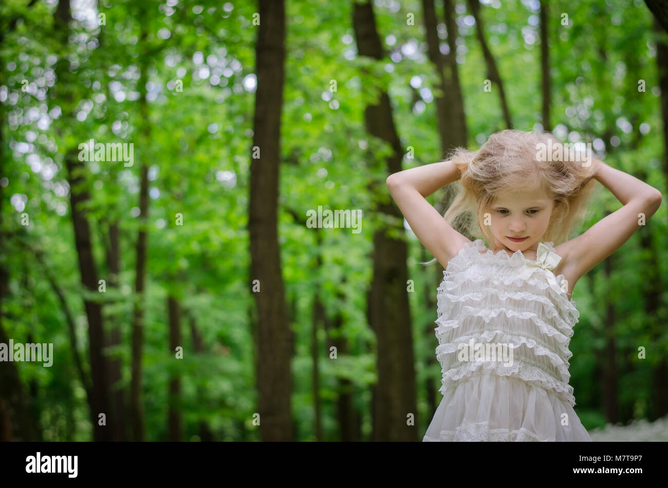 adorable little girl dancing in spring forest Stock Photo Alamy
