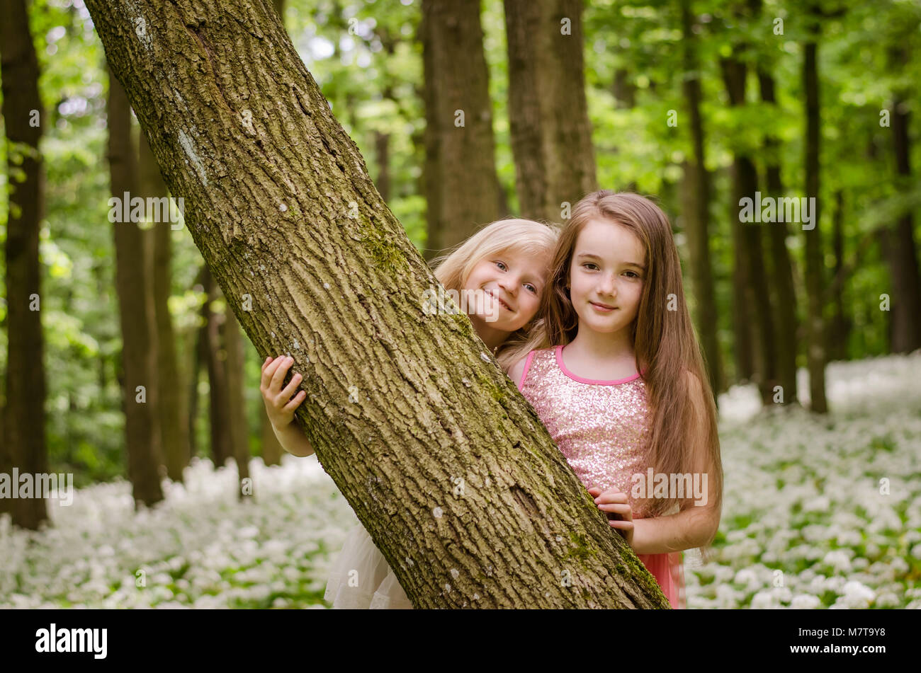 happy friends girls enjoying time in spring forest Stock Photo