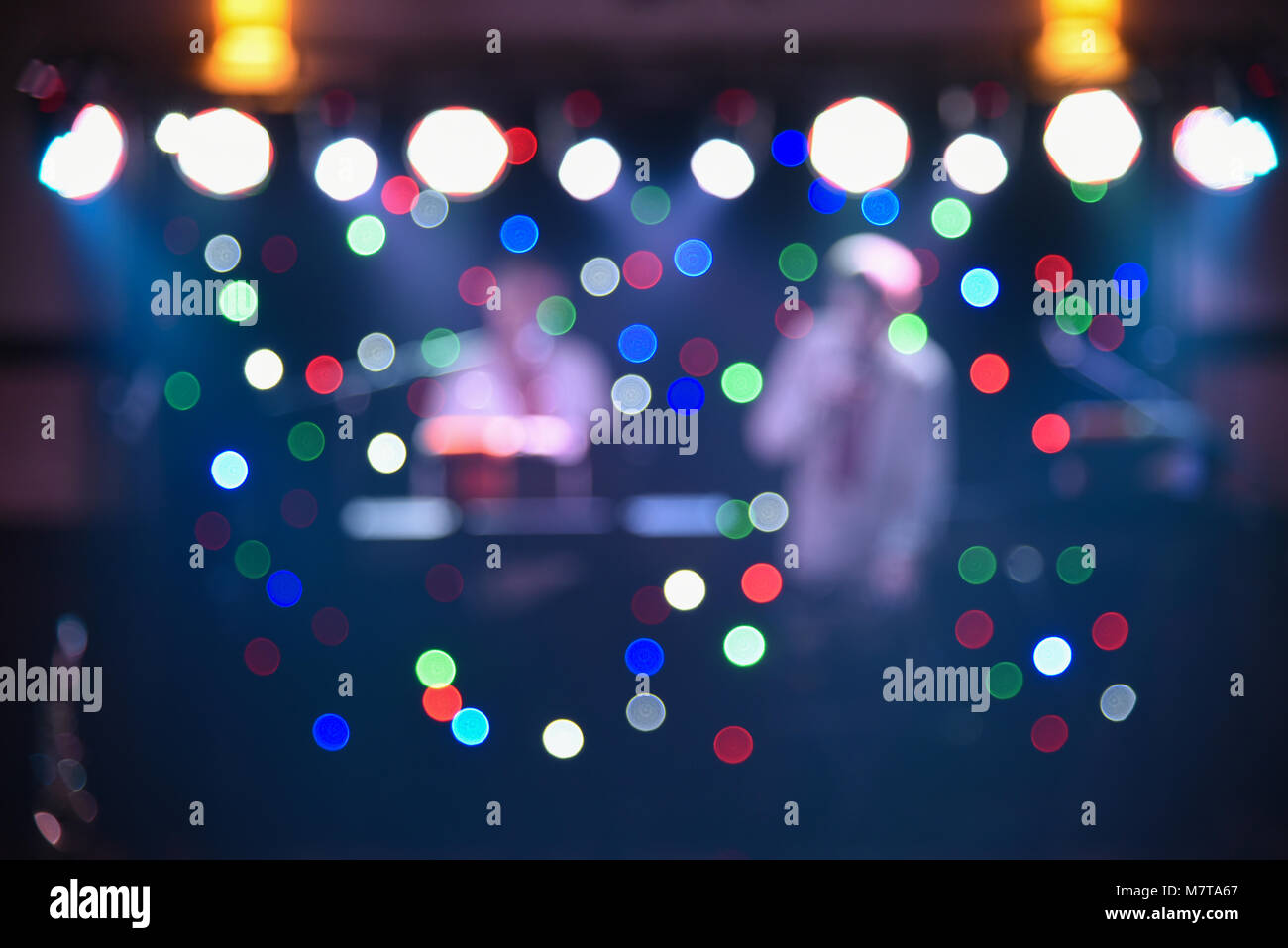 Blurry colorful background, light at a dance party, designer background for text overlay Stock Photo