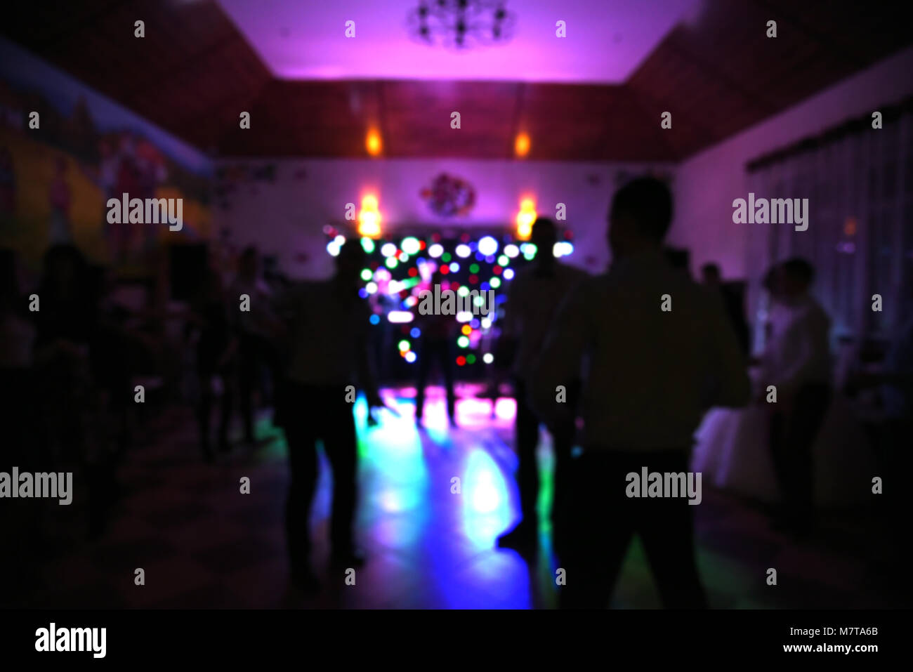 Blurry background, people at dance party, disco Stock Photo