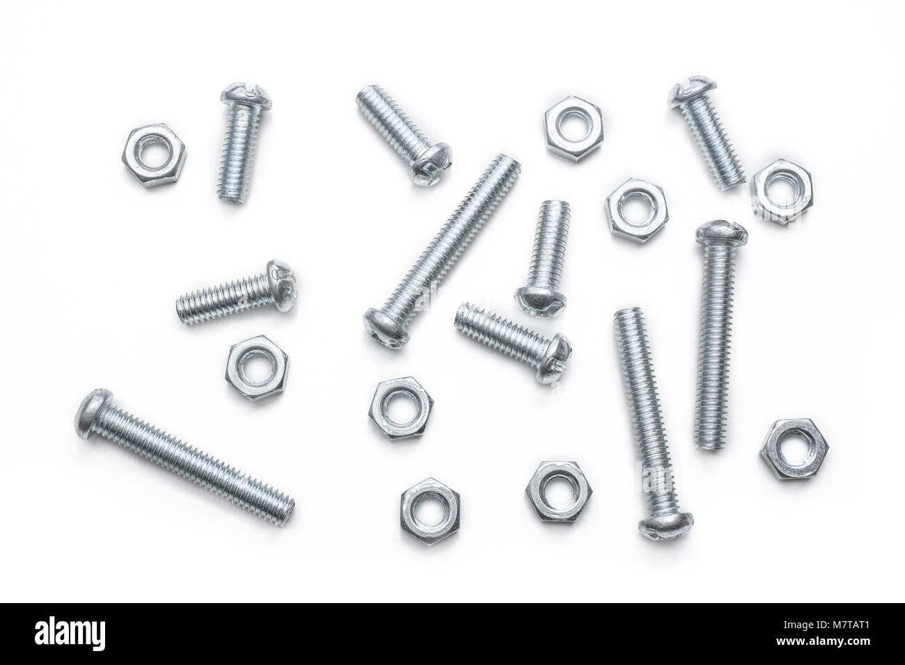 Macro Of A Small Collection Of Iron Screws And Bolts In A Whitebox Stock Photo