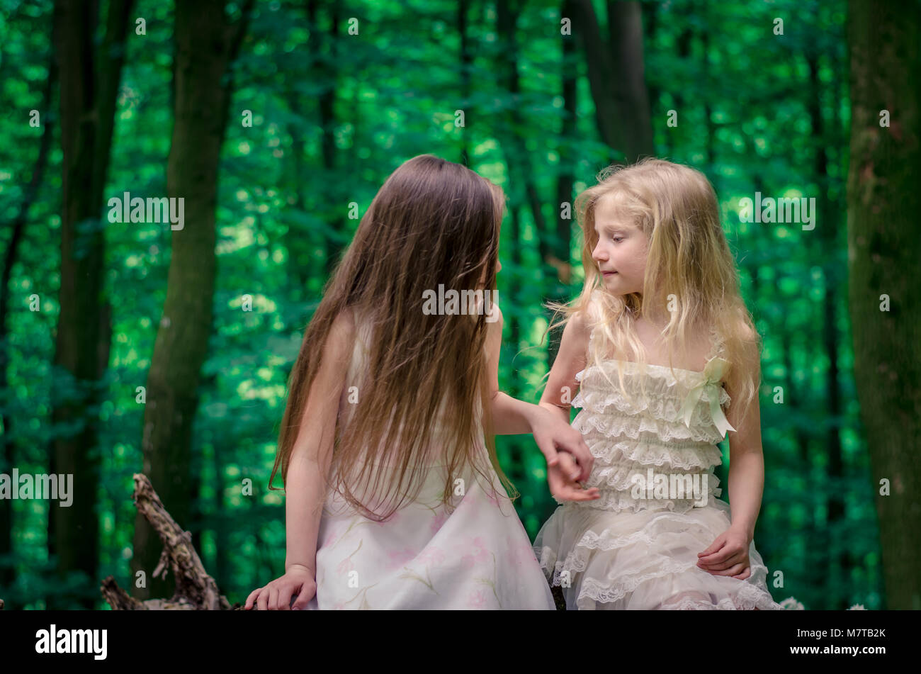 happy friends girls enjoying time in spring forest Stock Photo