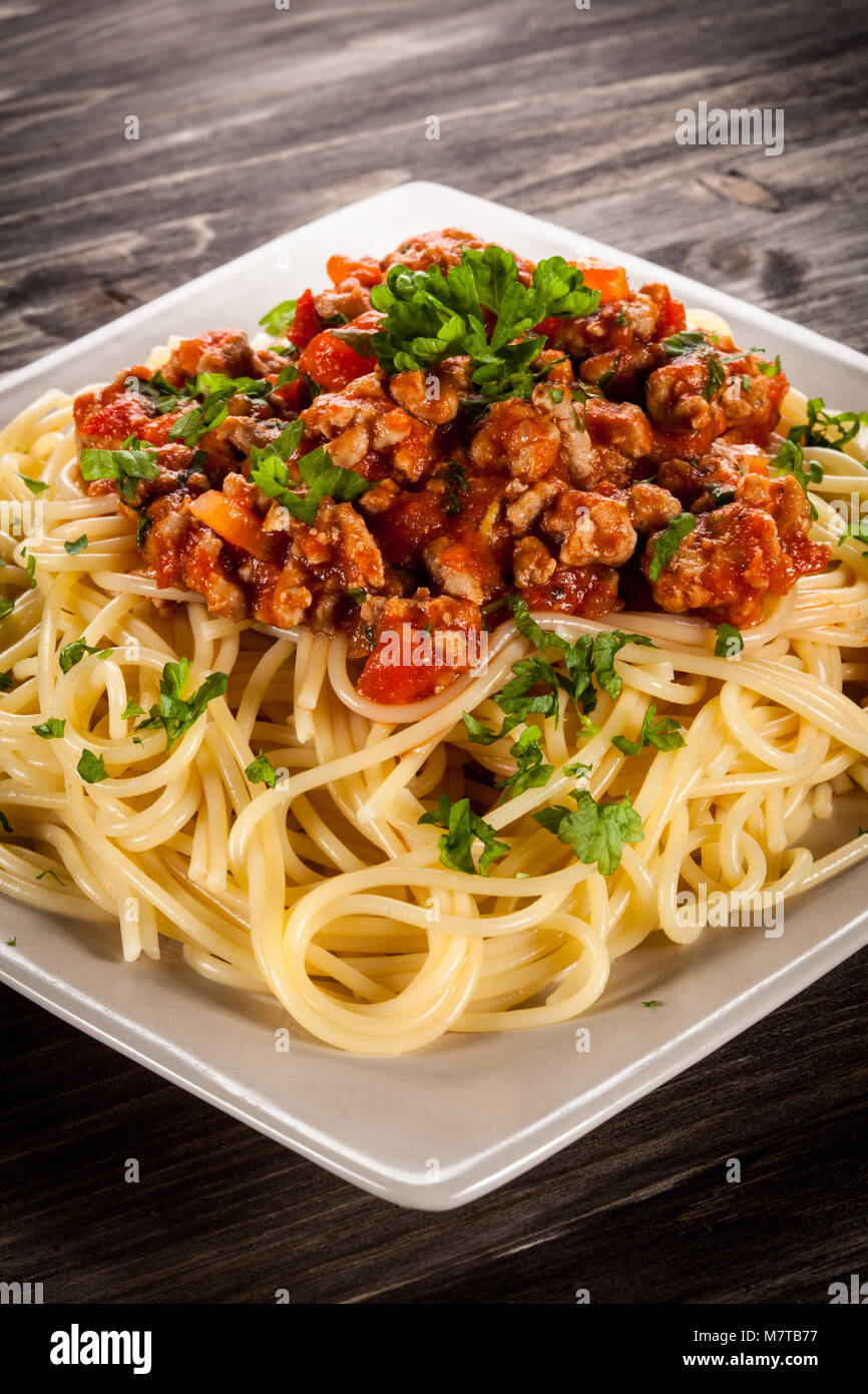 Spaghetti with meat, tomato sauce and vegetables Stock Photo - Alamy