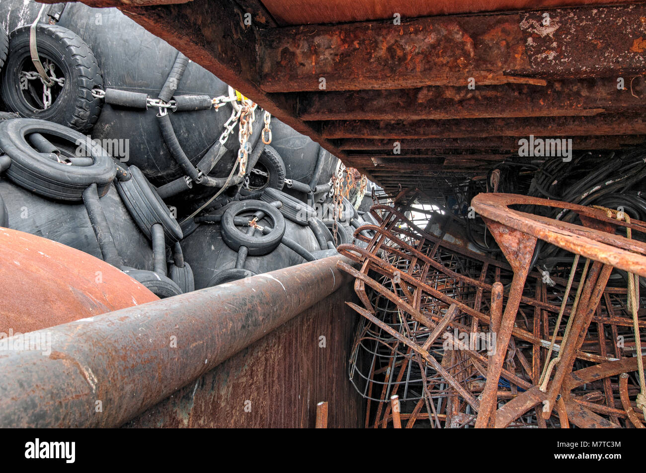 rusted scrap together in a large container Stock Photo