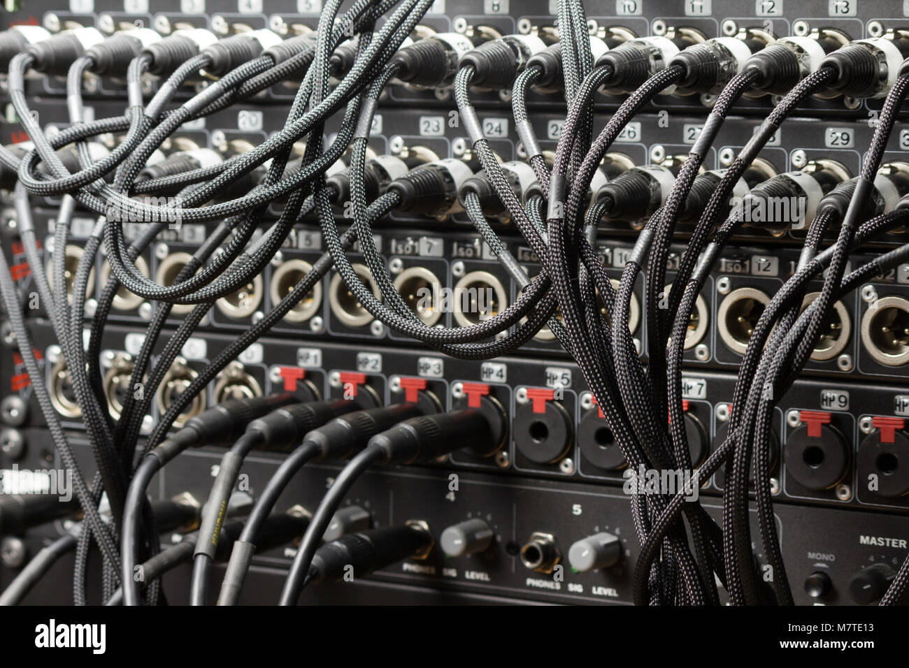 A bunch or cords that all play an important role in music production Stock Photo