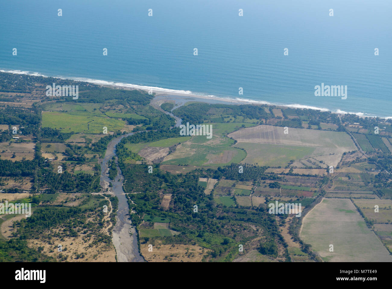 El Salvador aerial with farms and Pacific coast Stock Photo