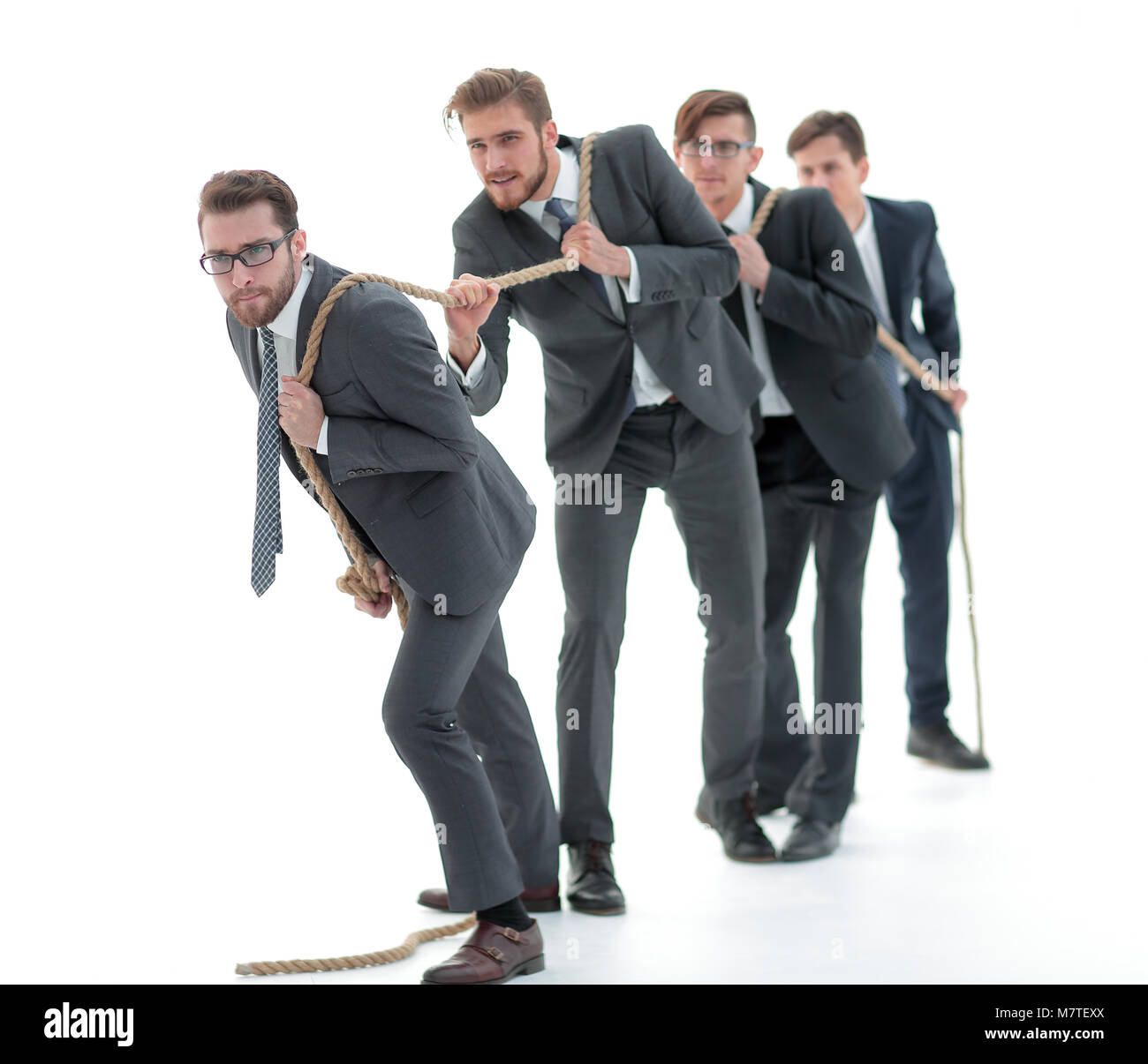 Team Members Pulling Rope closeup.smiling business team pulls the rope Stock Photo - Alamy