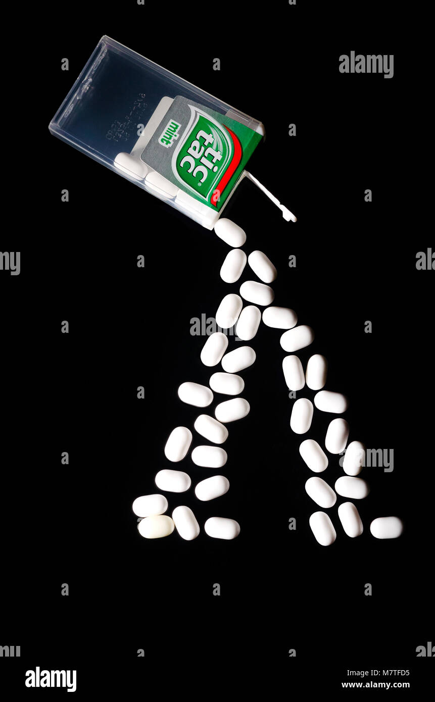 Falling tic tacs isolated on dark background. Tic tacs are manufactured by  Italian confectioner Ferrero and were first produced in 1968 Stock Photo -  Alamy