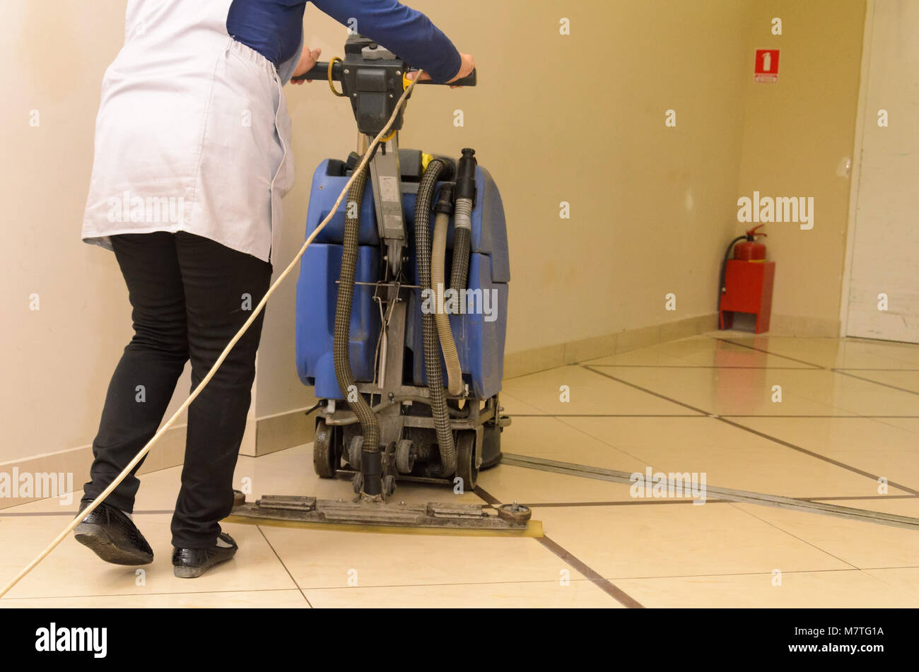 Floor care and cleaning services with washing machine Stock Photo