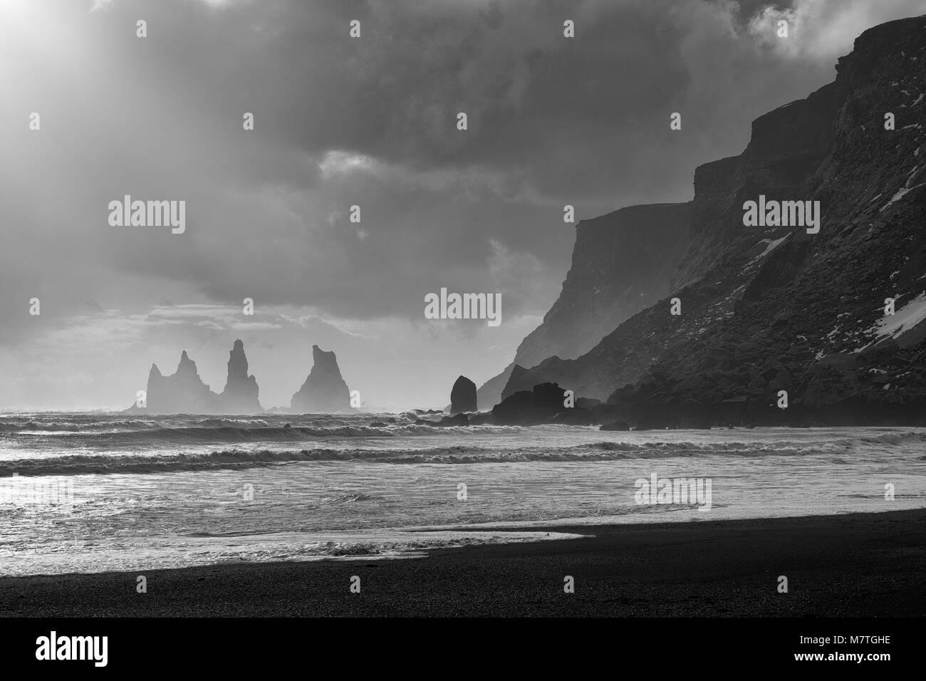 Reynisfjara black sand beach and Reynisdrangar basalt sea stacks as ...