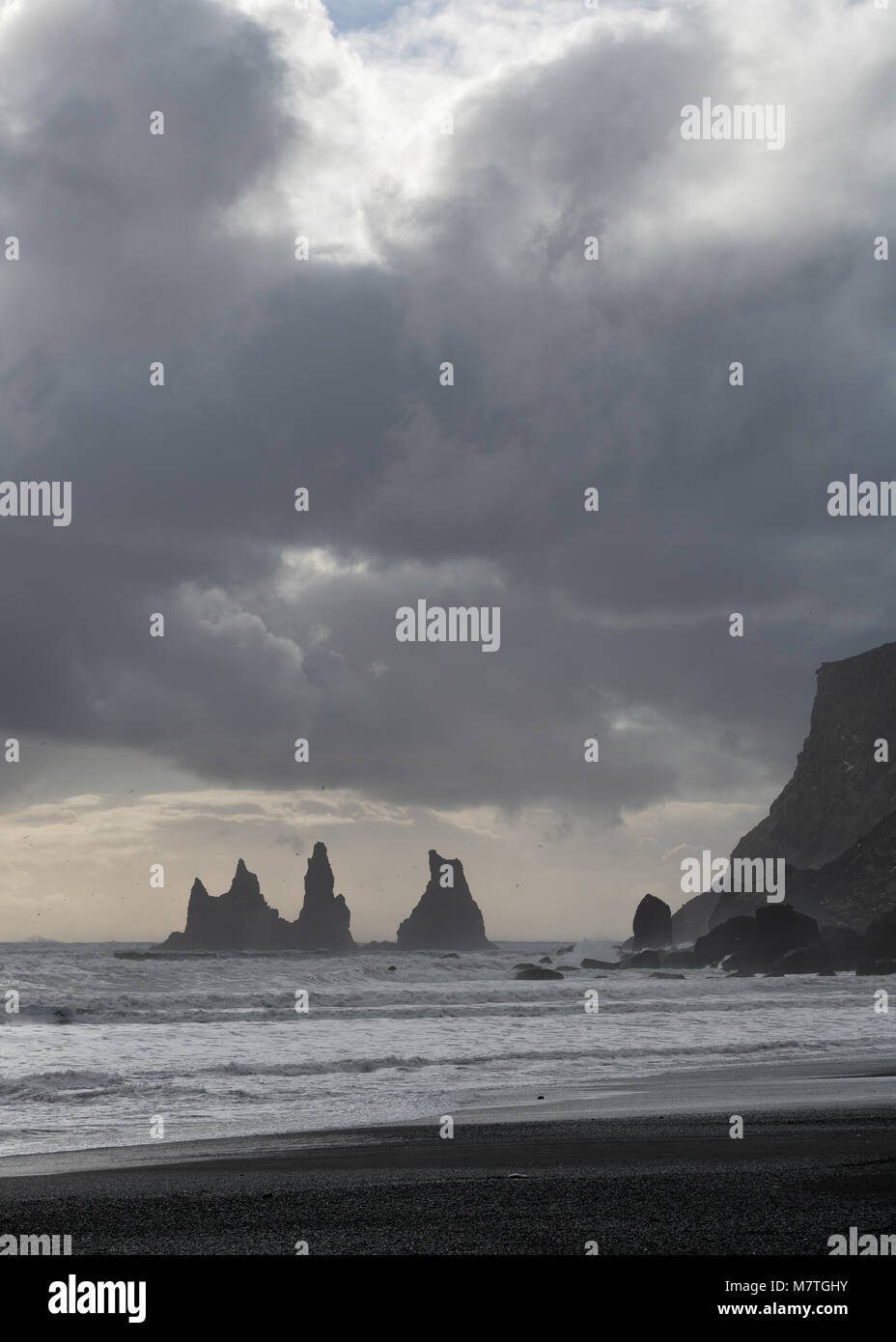 Reynisfjara black sand beach and Reynisdrangar basalt sea stacks as ...