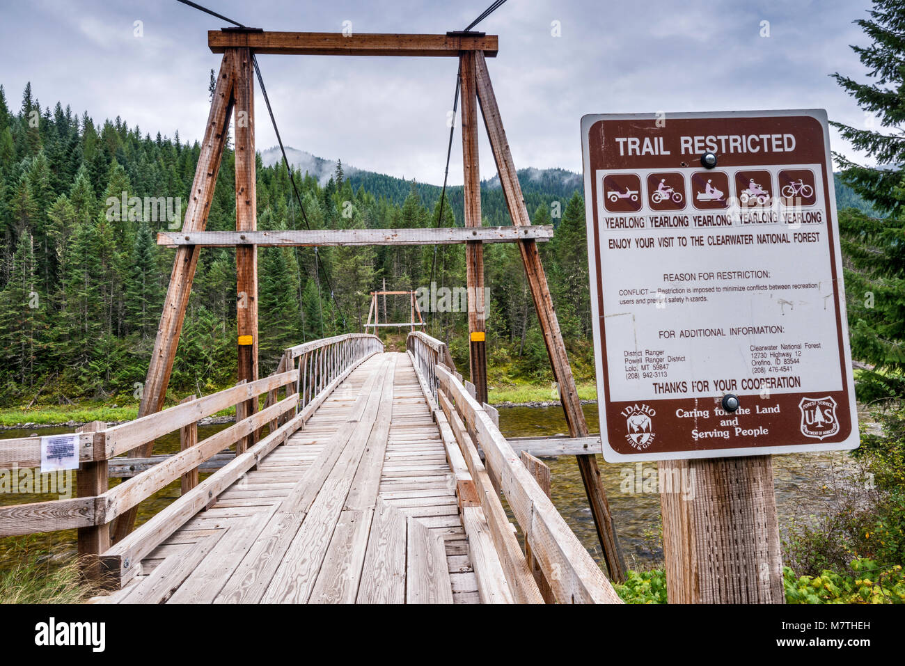 Suspension bridge over Lochsa River, for foot and pack horse access, Northwest Passage Scenic Byway, Clearwater National Forest, Idaho, USA Stock Photo