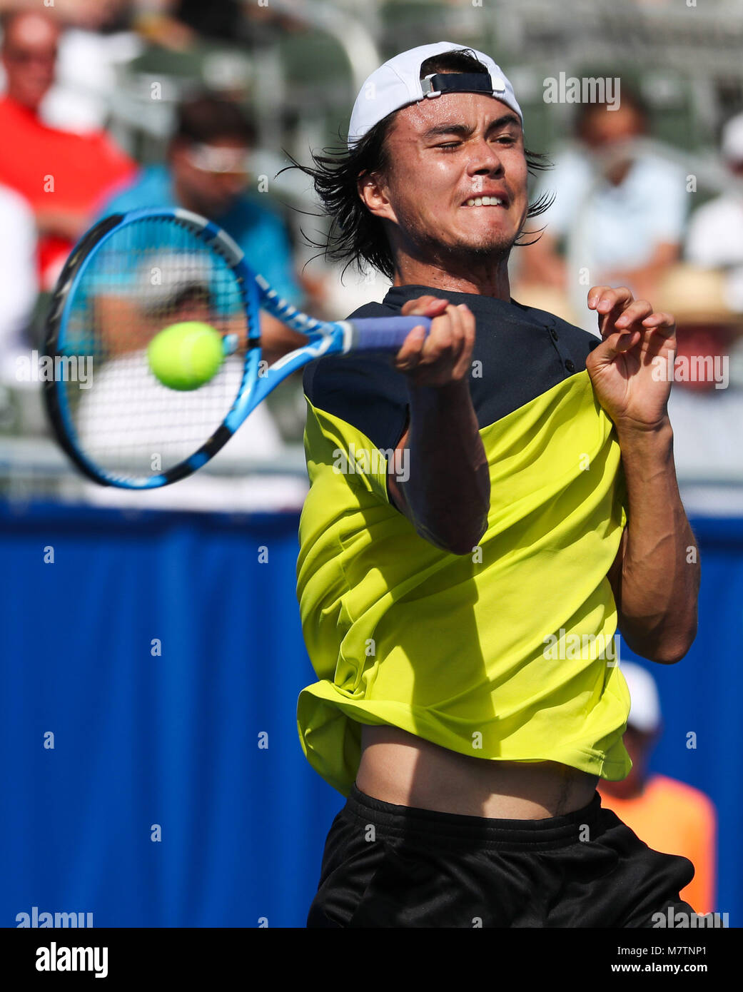 February 20, 2018: Taro Daniel, from Japan, hits a forehand against Milos  Raonic, from Canada, during the 2018 Delray Beach Open ATP professional  tennis tournament, played at the Delray Beach Stadium &