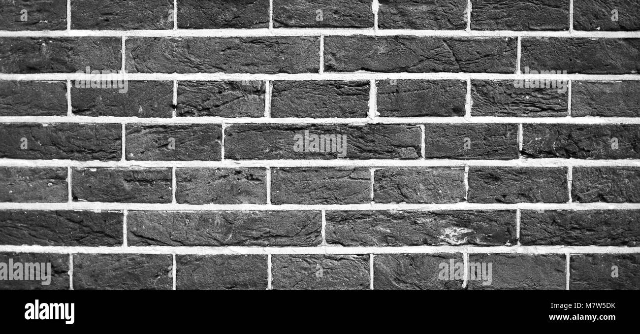 Old black and white brick wall texture background Stock Photo - Alamy